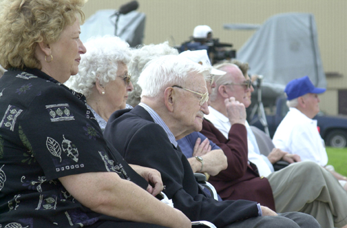 (Left to Right) Karen Carlson-Loving, daughter of Col. Evans Carlson, Jr. USMC (Ret.) and his wife Regina Carlson watch the C-130 carrying the remains of 13 Makin Raiders as it taxis down the runway.  Carlson Jr. is the son of Col. Evans Carlson who held command of the Makin Raiders.  Photo by: Sgt. M. V. Trindade